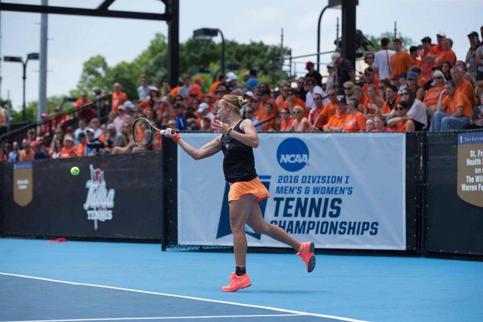 Female tennis player is hitting a forehand at the D1 national championships in 2016